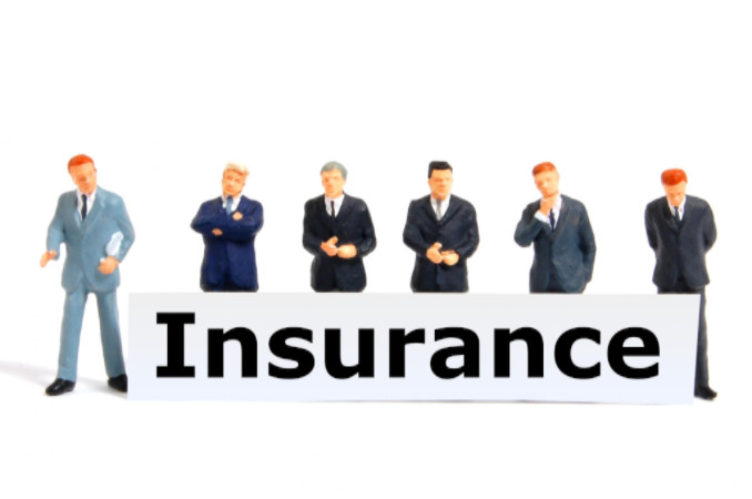 Insurance concept with toy businessmen: Max Filings After Incorporation Blog