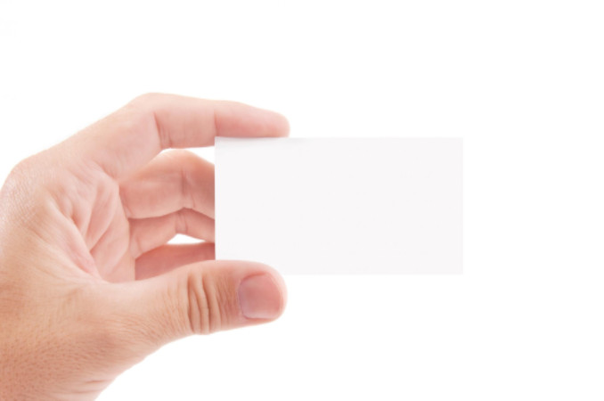 Hand holding blank business card: MaxFilings Corporations & LLCs Blog