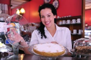 Woman in bakery: MaxFilings Small Business News Blog